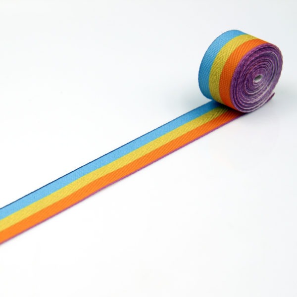 Lamówka tkana jodełka drukowana w kolorowe paski do odzieży i tkanin dekoracyjnych.