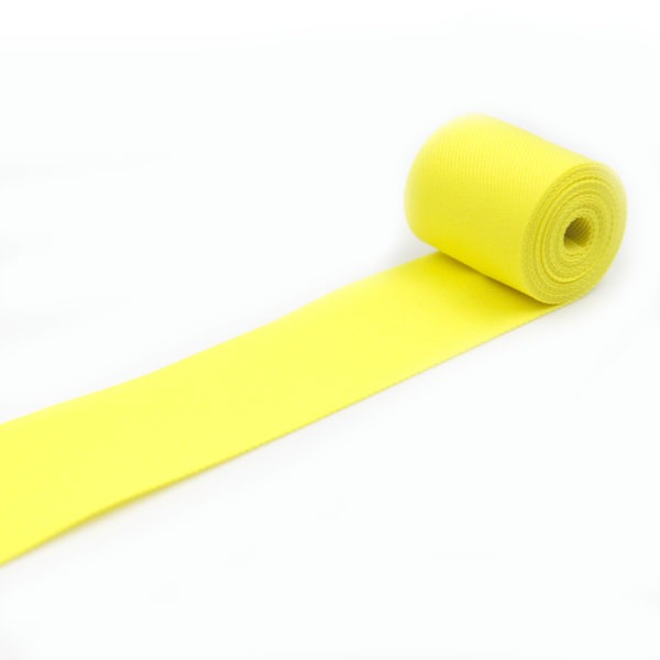 Taśma tkana w kolorze żółtym do odzieży i wyrobów kaletniczych.